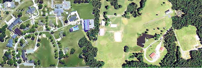 Aerial view of 40-acre residential treatment center (left hand) combined with a 40-acre experiential therapy center with stables, arena, greenhouses, ponds, conference center, family lodge, archery, maze, challenge course, sand volley ball, and arbor walk.