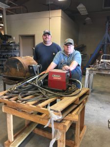 James Machine Works: Johnny Cox and Greg Hare deliver equipment to John H. Allen Vocational School.